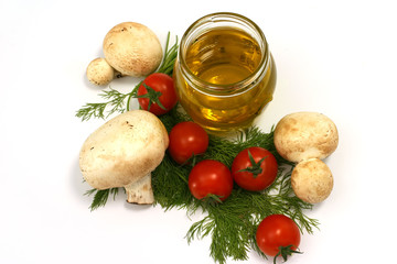 Olive oil in transparent jar,fennel,cherry tomato,mushroom