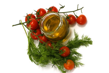 Olive oil in transparent jar,fennel,cherry tomato