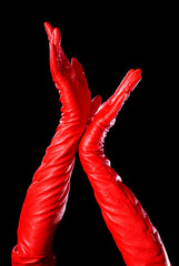 hands in red gloves showing some signs