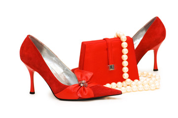 Red shoes, purse and pearl necklace isolated