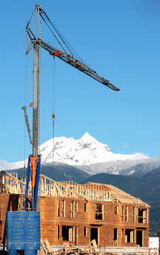 A crane seems to tower over a peak near Whistler, BC, Canada.