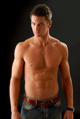 Fototapeta premium A handsome young man with no shirt on