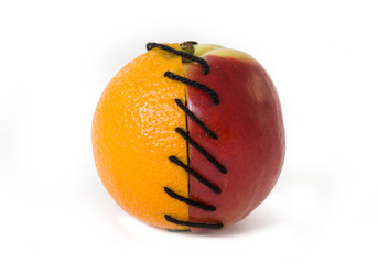 Half of apple and orange tied together  