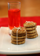 A stack of sugar cookies and juice