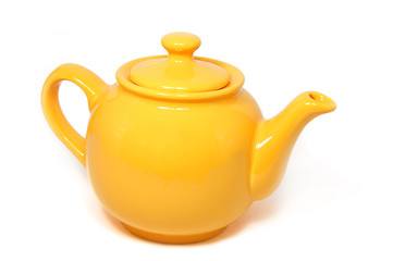 Yellow tea pot isolated on white
