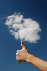 Hand over sky and clouds