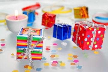 Fototapeta na wymiar Colorful gifts with shining ribbons on white background