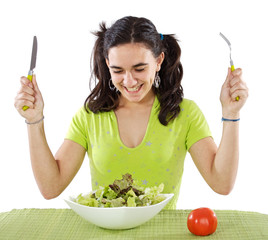 adolescent eating a salad a over white background