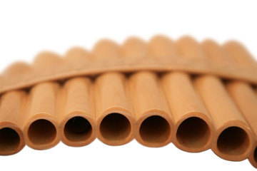 Wooden pan flute on a white background. It is isolated