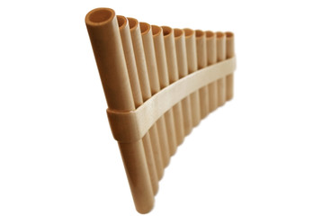 Wooden pan flute on a white background. It is isolated