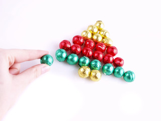Pralines in the colorful paper/ sweet christmas tree