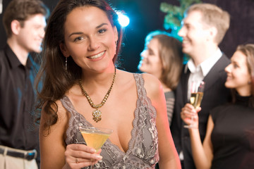 Portrait of charming woman holding her cocktail 