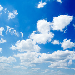 The blue sky and beautiful white clouds.
