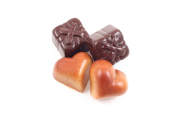 four delicious pralines - heart and gift shape 