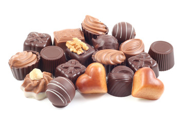 various delicious pralines isolated on white