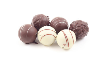six delicious truffles isolated on white