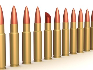 Lipstick among of some bullets. 3D image.