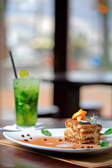 Tiramisu cake and mojito drink