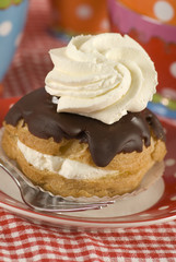 a chocolate eclair with whipped cream