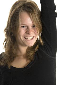a happy smiling teenage girl against white background