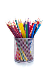 Multicolored pens on white background