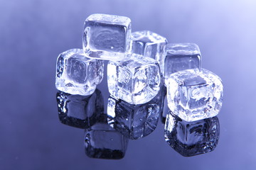 Ice cubes on reflective background