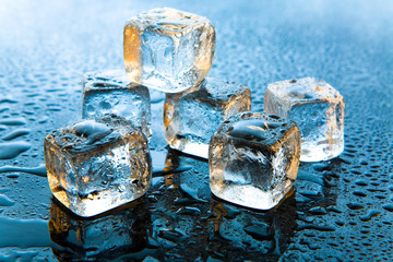 Ice cubes on reflective background