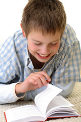 Boy learning on the floor.