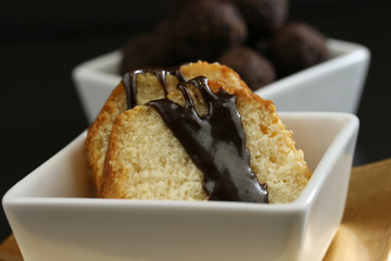 Cake with chocolate sauce and truffles for dessert