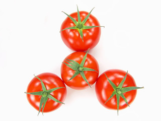 Isolated fresh tomatoes with stems close-up (vivid colors)