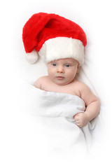 The Child in red hat of Santa on white background.