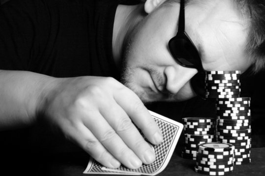 Poker gambler close-up. Black and white image.
