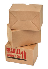 close-up of three cardboard boxes againt white background, 