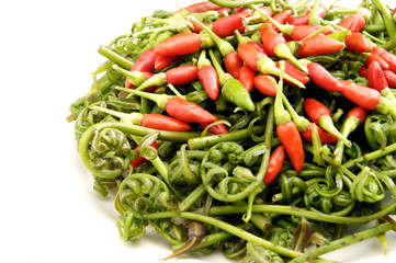 Red chillies with Bidin, an edible curvy fern