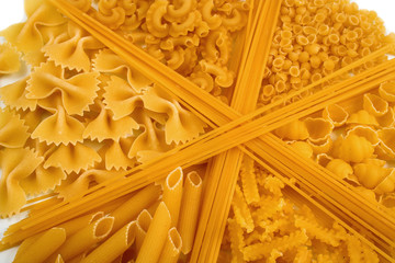 assorted pasta still life over white background