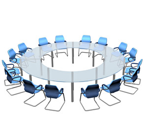 Empty seats round a boardroom conference table.