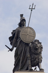 Proud Britannia, with sword in hand with lion standing ready