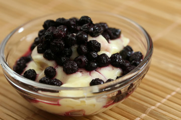 A bowl of fresh blueberries and pudding for a snack