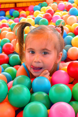 Fototapeta na wymiar Baby play with coloured balls