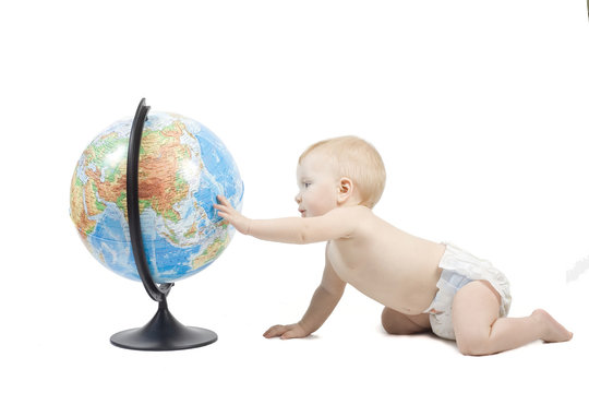 Child playing with globe