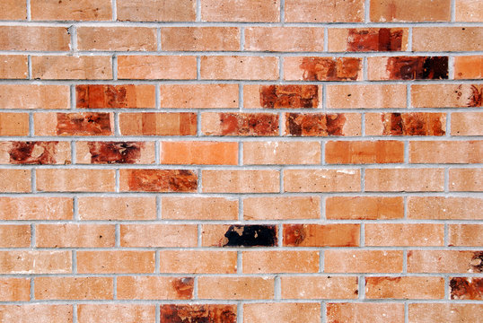 Colored Red Bricks Forming a Patterned Background