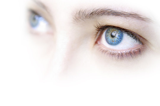 Close up view of a young woman's beautiful blue eyes