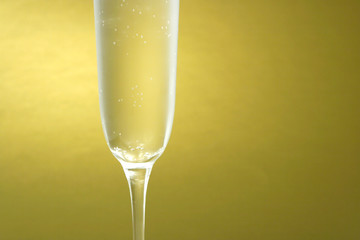 Flute of Champagne on a golden background horizontal