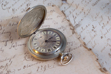 Old-time watch,current of time,handwritten documents,history