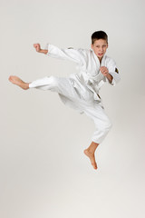 boy jump in the kimono, practice of aikido