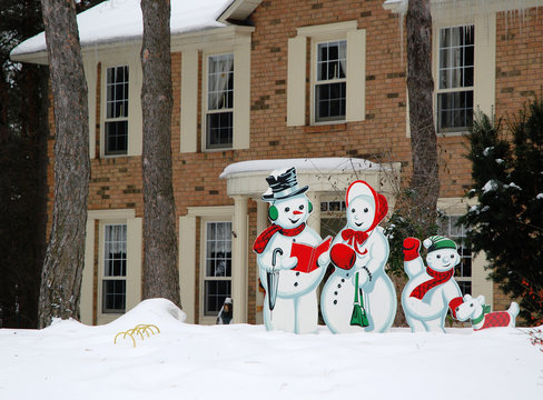 Snowman Family In Front Of Their House