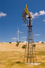 An old windmill and new wind turbines 