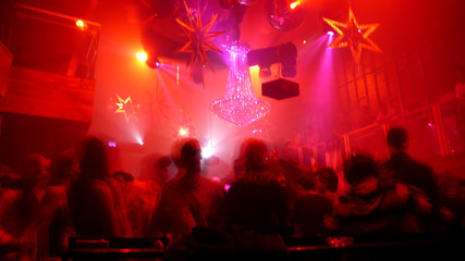 Nightclub scene with christmas decor and dance floor crowd
