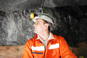 Miner profile in a mine shaft stock photo