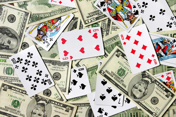 Dollar banknotes and playing cards